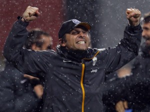 Juventus' coach   Conte celebrates his team's third goal against  Sassuolo during their Italian Serie A soccer match in Reggio Emilia